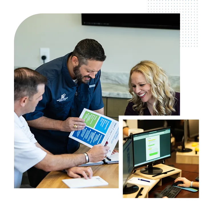 Impact Group Marketing team reviewing designs together