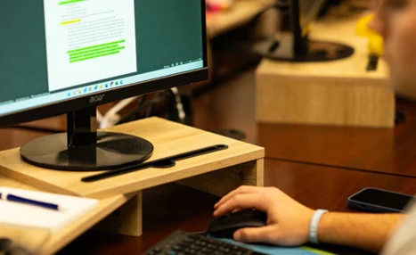 Person working on website updates at a desktop computer